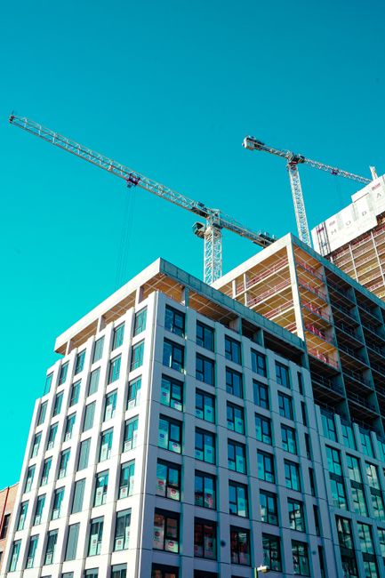 Construction cranes at a building site