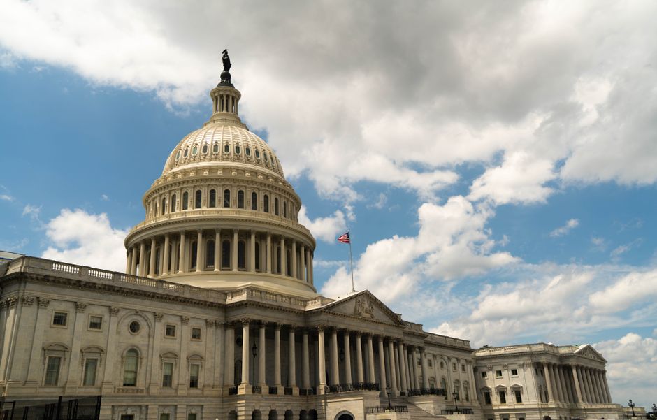 The United States Capitol building dome against a blue sky in Washington, DC, where the Senate voted 86-12 to advance the Graham Russia Sanctions Act.