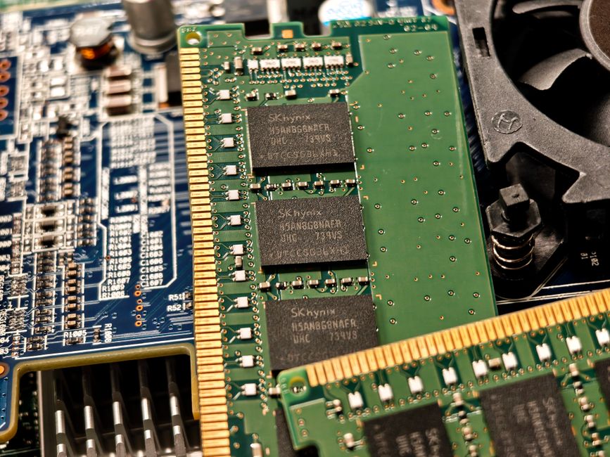 Close-up of a computer circuit board with memory modules and electronic components